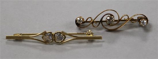 An early 20th century yellow metal and three stone diamond bar brooch and one other 9ct gold bar brooch.